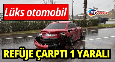 Kontrolden çıkan lüks otomobil refüje çarptı: 1 yaralı