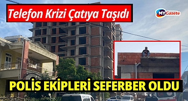 Tartıştığı eşi telefonlara bakmıyor diye çatıya çıktı