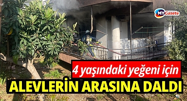 Yanan evden 4 yaşındaki yeğenini çıkarmak isterken yaralandı