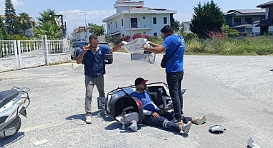 Antalya Manavgat'ta kaza yapan mesai arkadaşlarını güneşten korumaya çalıştılar