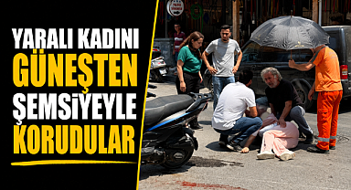 Antalya Serik'te yürek ısıtan dayanışma! Yaralı kadını güneşten şemsiyeyle korudular