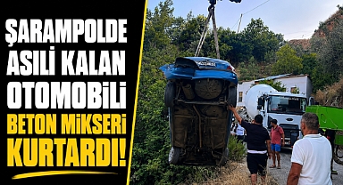 Sürücüsüyle şarampolde asılı kalan otomobil, beton mikserine halatla sabitlendi